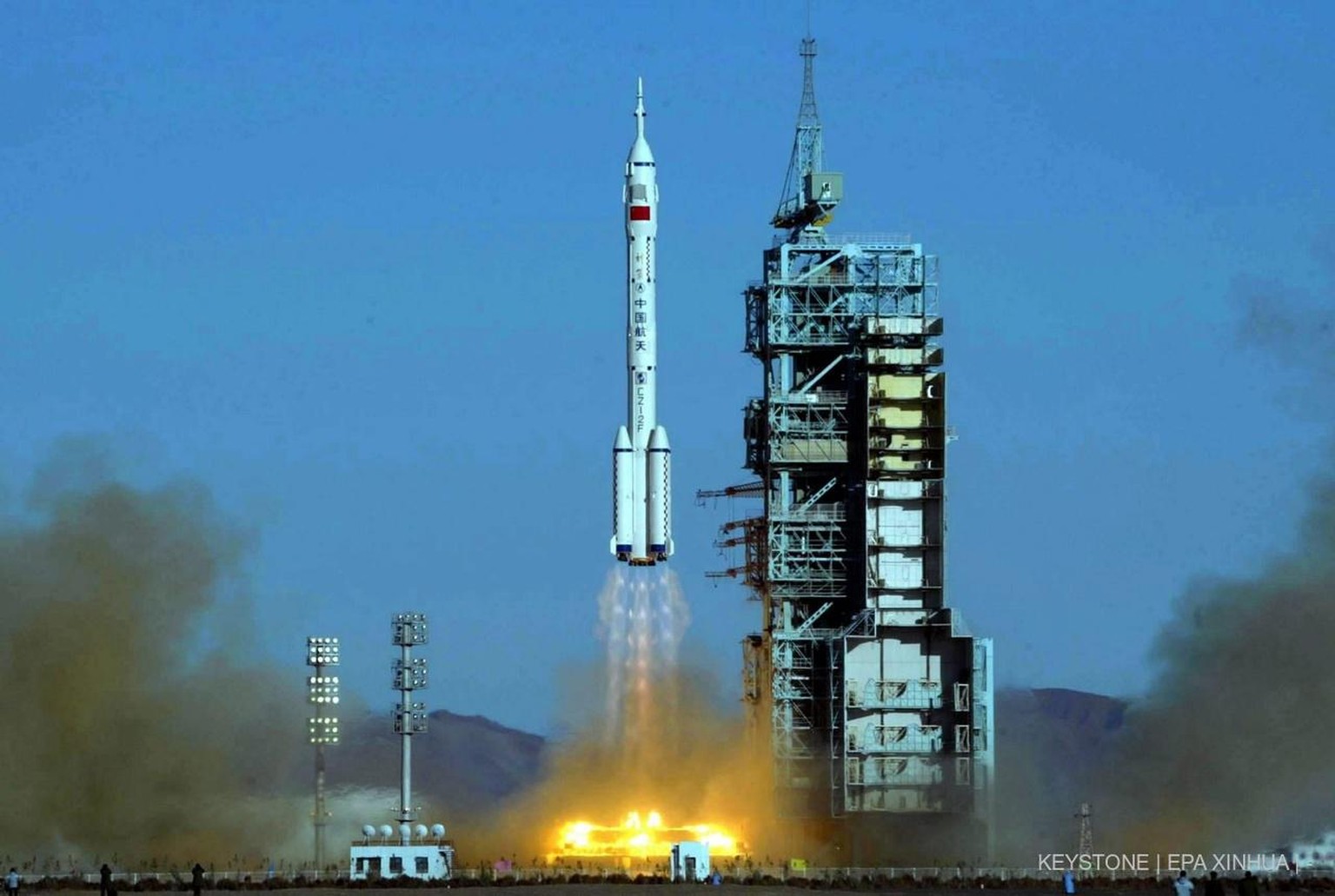 The Long March 2F rocket with Shenzhou V capsule carrying 38 year old Yang Liwei, the first Chinese to go into space, takes off from a desert launch pad in the Inner Mongolian autonomous region in wes ...