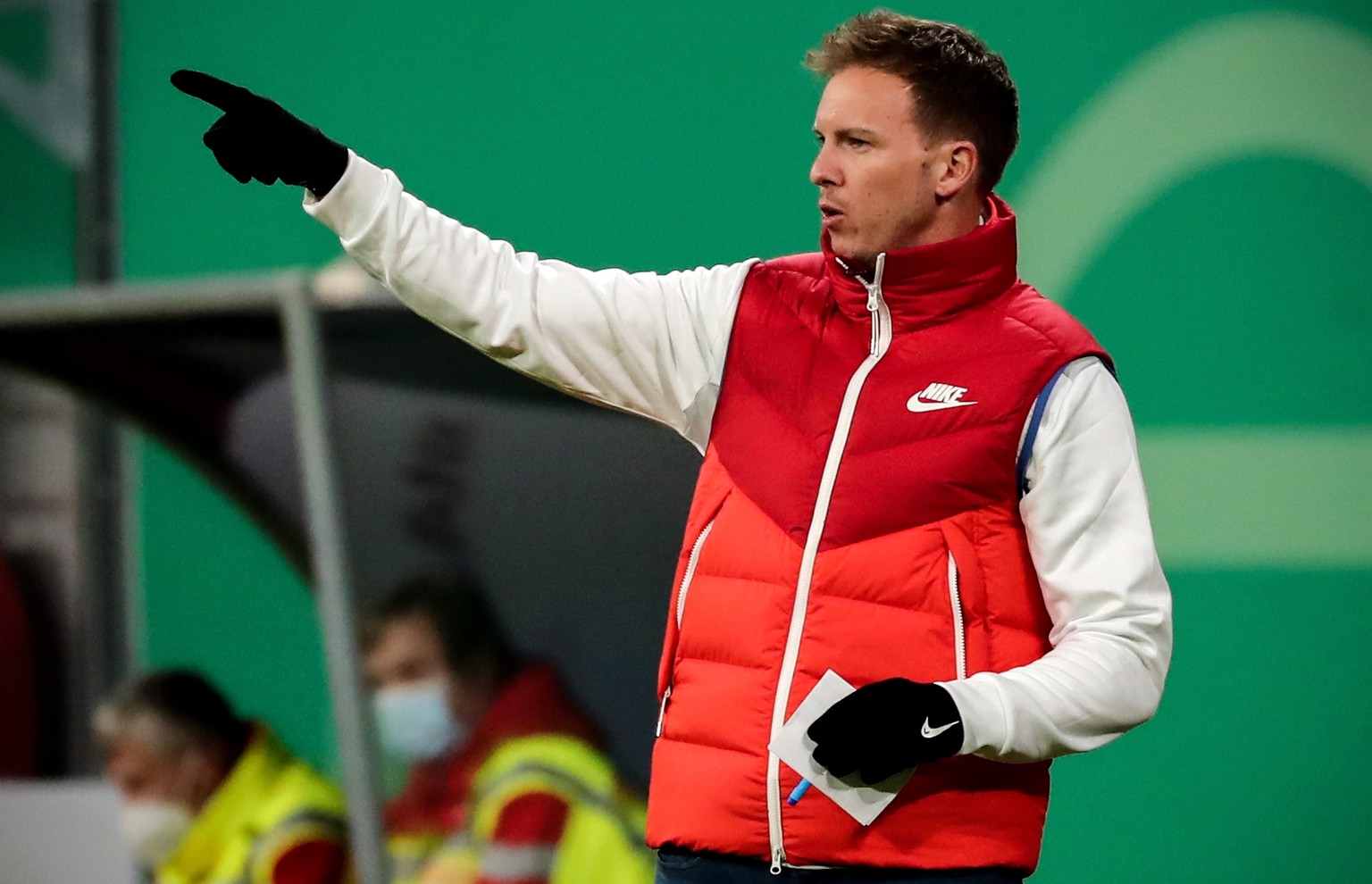 epa09050030 Leipzig&#039;s head coach Julian Nagelsmann gestures during the German DFB Cup quarter final soccer match between RB Leipzig and VfL Wolfsburg in Leipzig, Germany, 03 March 2021. EPA/FILIP ...