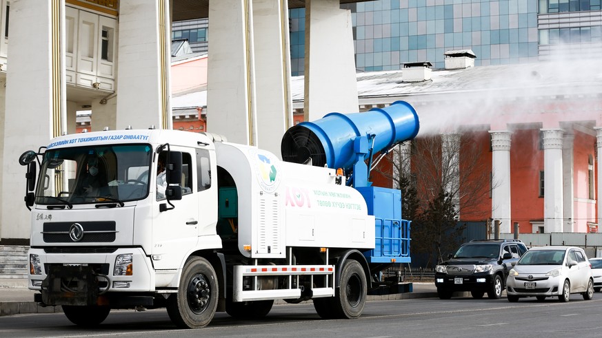epa08300047 Disinfection work is carried out on Sukhbaatar square in Ulaanbaatar, Mongolia, 17 March 2020. Mongolia reported three new cases of coronavirus infection among citizens repatriated from So ...