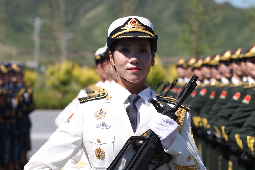 BEIJING, CHINA - AUGUST 22: (CHINA OUT) A female soldier from the Chinese People&#039;s Liberation Army attends a training session for the September 3 military parade to mark the 70th anniversary of t ...