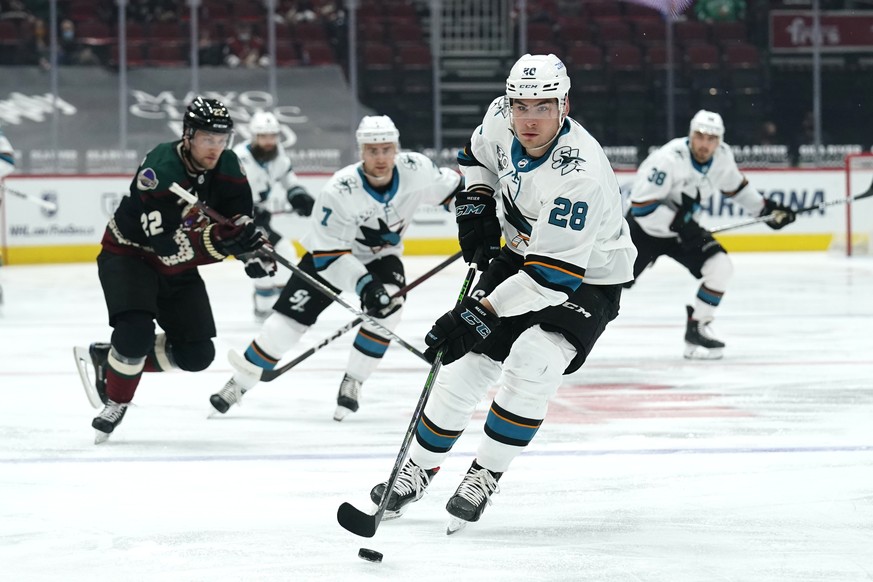 San Jose Sharks right wing Timo Meier (28) carries the puck against the Arizona Coyotes in the first period during an NHL hockey game, Friday, March 26, 2021, in Glendale, Ariz. (AP Photo/Rick Scuteri ...