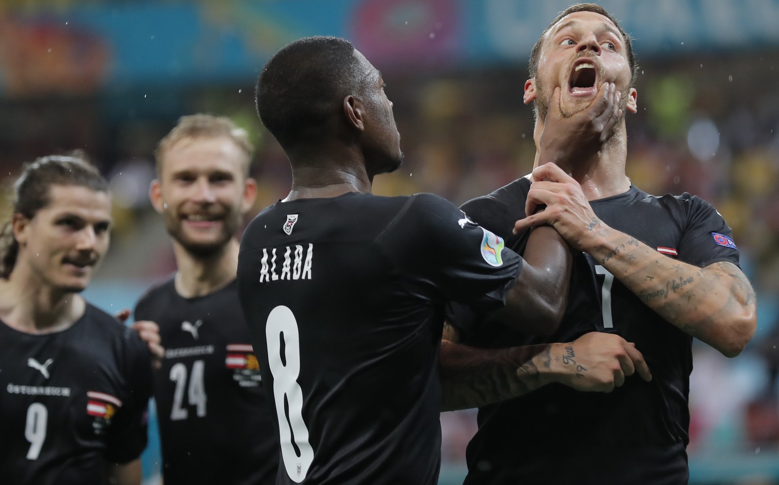 Austria&#039;s Marko Arnautovic, right, celebrates with Austria&#039;s David Alaba after scoring his side&#039;s third goal during the Euro 2020 soccer championship group C match between Austria and N ...