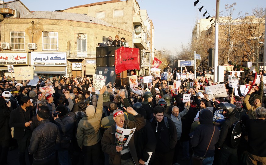 epa08122788 Iranian hardliners gather in front of the British embassy during an anti-Britain protest, in Tehran, Iran, 12 January 2020. According to reports, hundreds of Iranian hardliners gathered fo ...