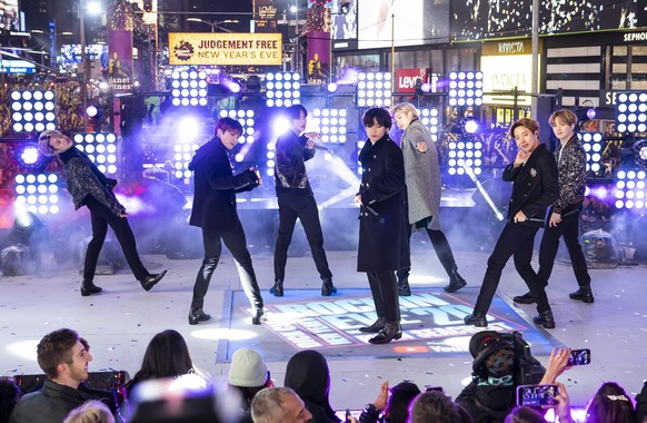 FILE - Members of BTS perform at the Times Square New Year&#039;s Eve celebration in New York on Dec. 31, 2019. The South Korean boy band BTS HAS won a leading four awards including best song for