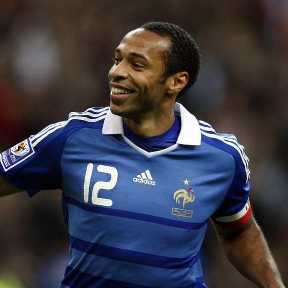 FILE - In this Wednesday Oct. 14, 2009 file photo, France&#039;s Captain Thierry Henry celebrates after scoring a penalty against Austria during their World Cup 2010 qualifying soccer match at Stade d ...