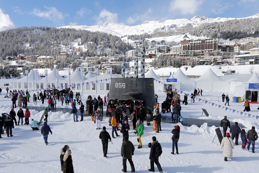 epa04064250 A submarine boat built by Swiss artist Andreas Reinhard in the frozen lake of St. Moritz, during the White Turf horse races on Snow in St. Moritz, Switzerland, 09 February 2014. Inside the ...