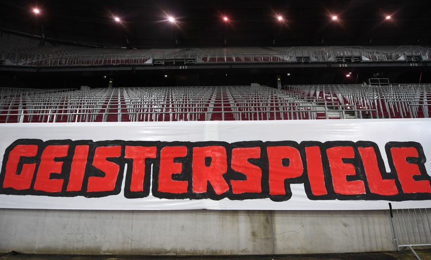 epa08452957 A banner reading &#039;Ghost matches&#039; in front of empty stands during the Austrian OEFB Cup Final soccer match between Red Bull Salzburg and Austria Lustenau in Klagenfurt, Austria, 2 ...