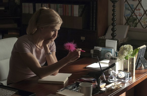 In this image released by 20th Century Fox, Rosamund Pike appears in a scene from &quot;Gone Girl.&quot; The film, based on the best-selling novel, will release on Oct. 3. (AP Photo/20th Century Fox,  ...