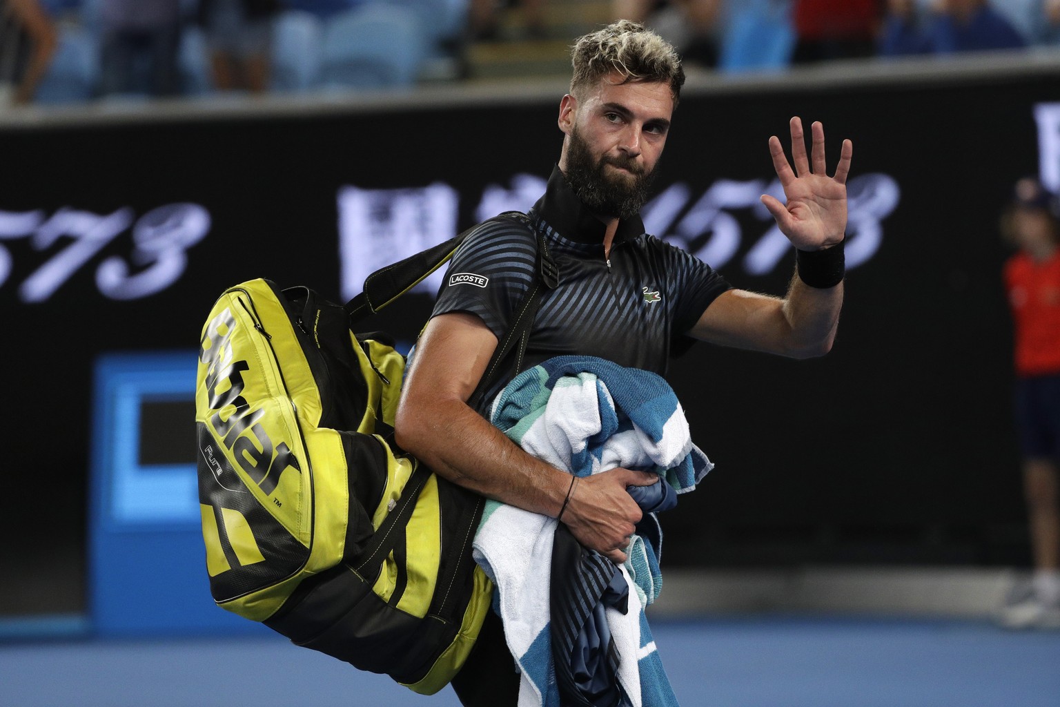 France&#039;s Benoit Paire leaves the court after losing to Austria&#039;s Dominic Thiem in their first round match at the Australian Open tennis championships in Melbourne, Australia, early Wednesday ...