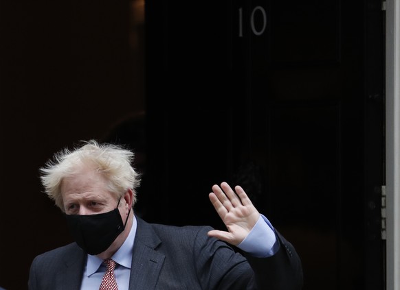 Britain&#039;s Prime Minister Boris Johnson waves to the media as he leaves 10 Downing Street or go to the House of Commons his weekly Prime Minister&#039;s Questions in London, Wednesday, Sept. 30, 2 ...