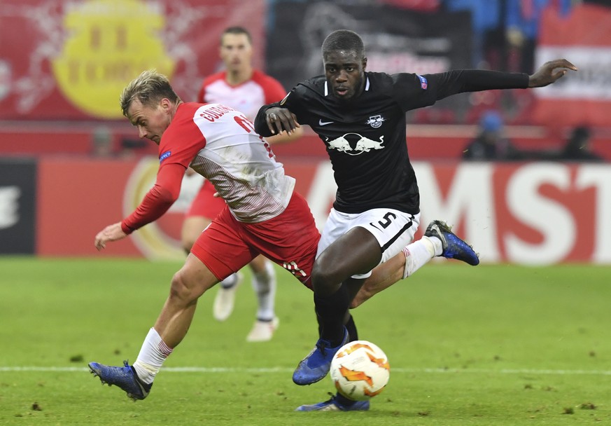 Leipzig&#039;s Dayot Upamecano, right, challenges for the ball with Salzburg&#039;s Fredrik Gulbrandsen, during the Europa League, Group B, soccer match between FC Salzburg and RB Leipzig on the Stati ...