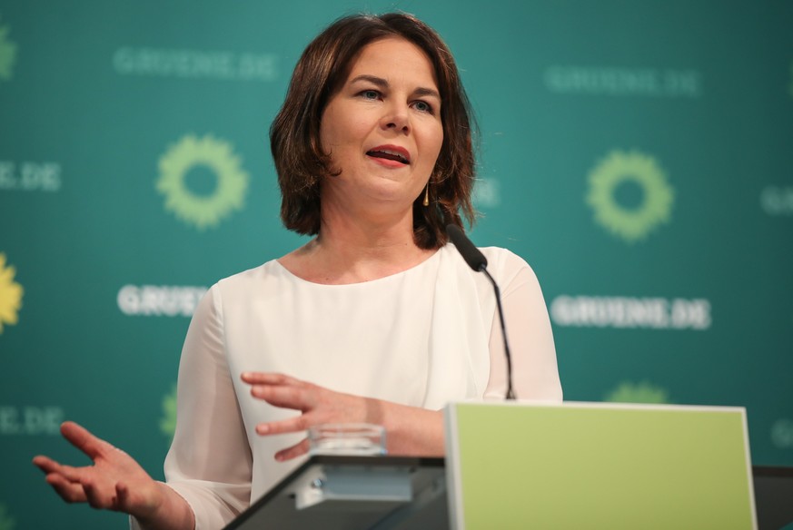 epa09290469 Annalena Baerbock, Party Chairwoman and Chancellor candidate of Buendnis 90 / Die Gruenen, gives a press statement in Heinrich-Boell-Stiftung in Berlin, Germany, 21 June 2021. EPA/ANDREAS  ...