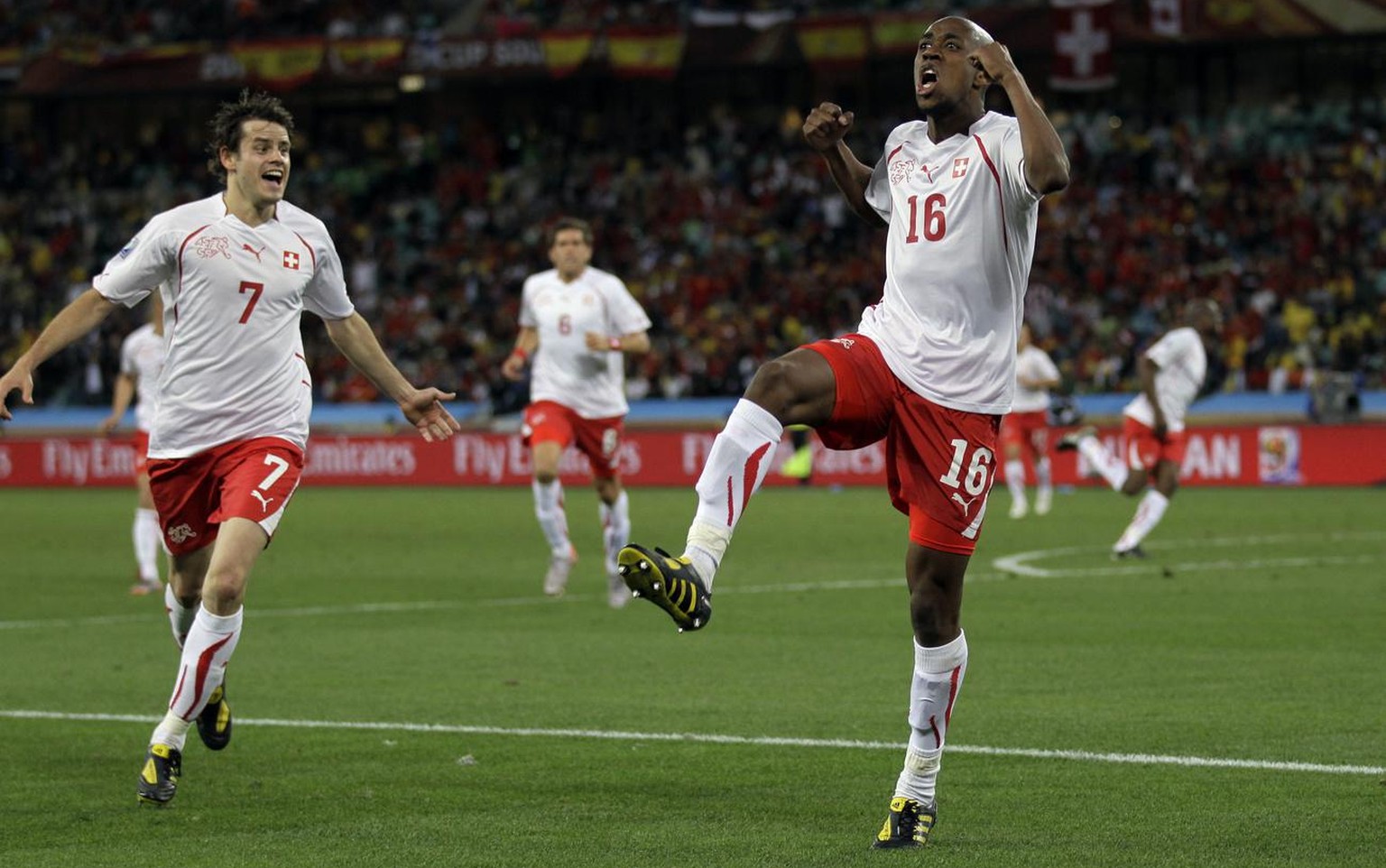 Switzerland&#039;s Gelson Fernandes, right, celebrates with teammate Switzerland&#039;s Tranquillo Barnetta after scoring the opening goal during the World Cup group H soccer match between Spain and S ...