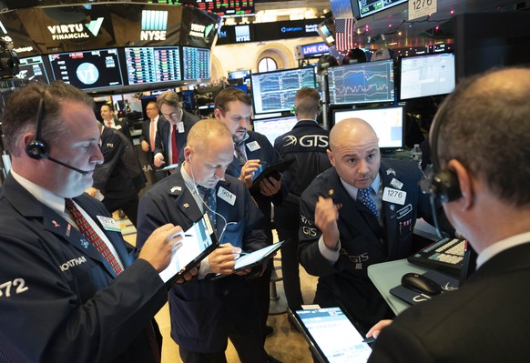 Stock traders work at New York Stock Exchange, Tuesday, Dec. 31, 2019. Stocks slipped globally in quiet New Year&#039;s Eve trading Tuesday with many markets closed. Wall Street could close 2019 with  ...
