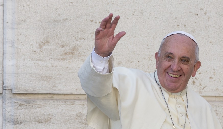 Pope Francis waves to members of the media as he leaves a morning session of a two-week synod on family issues, at the Vatican, Friday, Oct. 10, 2014. Gay rights groups are cautiously cheering a shift ...