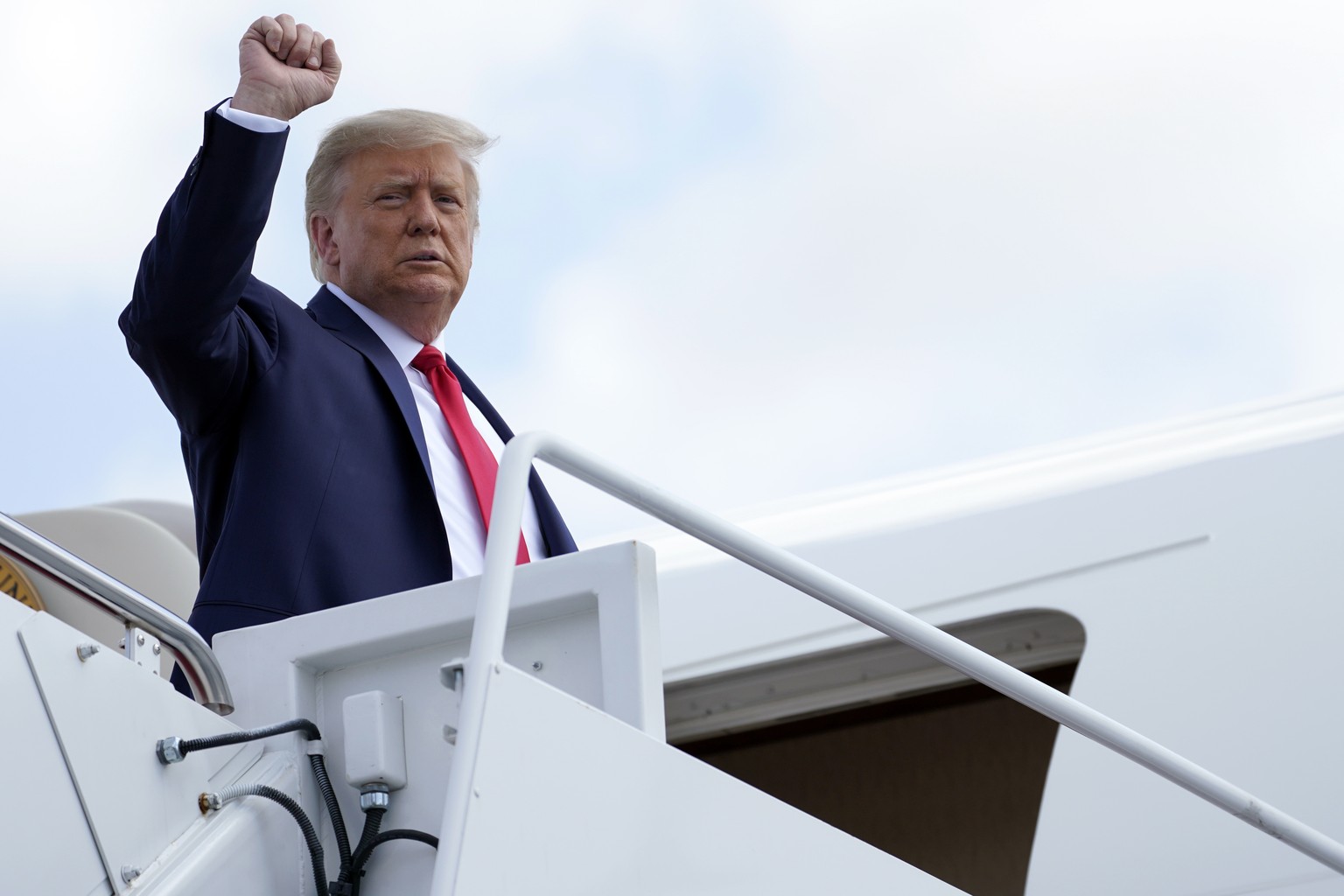 President Donald Trump boards Air Force One for a trip to Jupiter, Fla., to speak about the environment, Tuesday, Sept. 8, 2020, at Andrews Air Force Base, Md. He will also travel to a campaign rally  ...