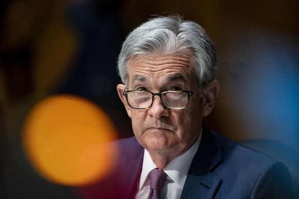 FILE - In this Dec. 1, 2020 file photo, Federal Reserve Chair Jerome Powell listens during a Senate Banking Committee hearing on Capitol Hill in Washington. Powell on Thursday, April 8, 2021 said the  ...