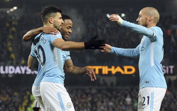 Manchester City&#039;s Sergio Aguero, left, celebrates with Raheem Sterling and David Silva, right, after scoring his side&#039;s second goal during the English Premier League soccer match between Man ...