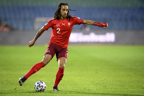 Switzerland&#039;s defender Kevin Mbabu runs with the ball during the closed door FIFA World Cup Qatar 2022 qualifying Group C soccer match between Bulgaria and Switzerland during the coronavirus dise ...
