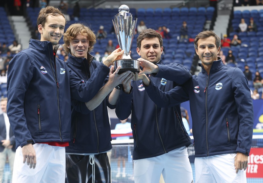 Russia&#039;s ATP Cup winners Daniil Medvedev, Andrey Rublev, Aslan Karatsev and Evgeny Donsky pose with their trophy after defeating Italy in the final in Melbourne, Australia, Sunday, Feb. 7, 2021.( ...