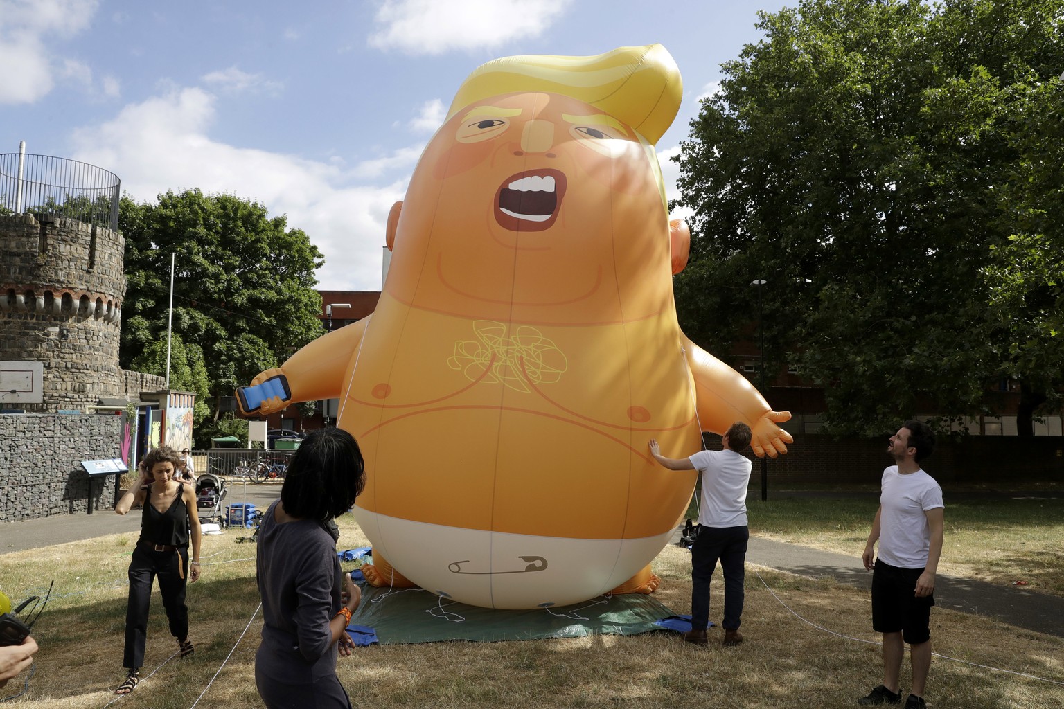 FILE - In this file photo taken Tuesday, July 10, 2018, a six-meter high cartoon baby blimp depicting U.S. President Donald Trump in north London. The President Trump blimp will become part of the Mus ...