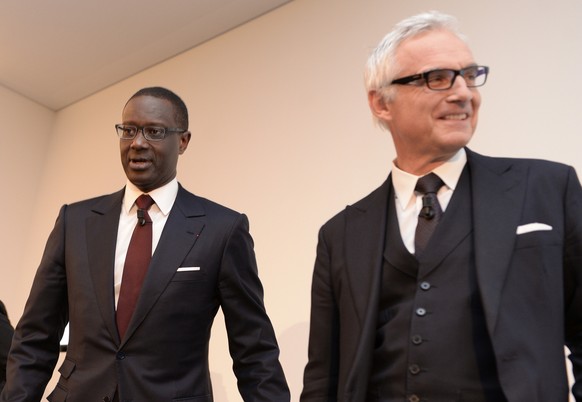 Tidjane Thiam, current head of British insurer Prudential, left, and Urs Rohner, Chairman Credit Suisse, right, arrive for a press conference of Swiss Bank Credit Suisse in Zurich, Switzerland, Tuesda ...