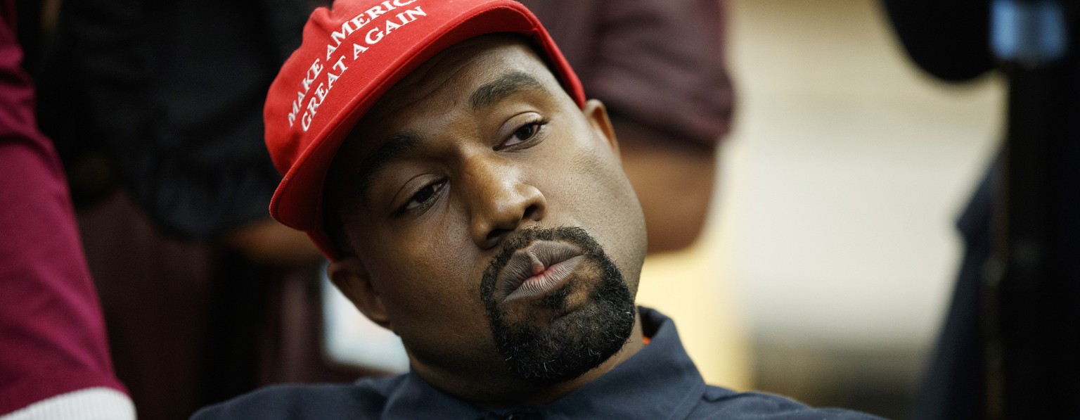 FILE - In this Oct. 11, 2018, file photo rapper Kanye West listens to a question from a reporter during a meeting in the Oval Office of the White House with President Donald Trump in Washington. On Su ...