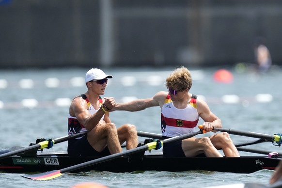 Jonathan Rommelmann and Jason Osborne, of Germany react after competing in the lightweight men&#039;s rowing double sculls semifinal at the 2020 Summer Olympics, Wednesday, July 28, 2021, in Tokyo, Ja ...
