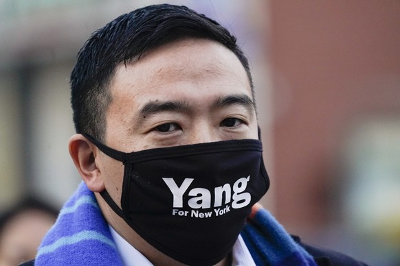 Andrew Yang crosses the street Thursday, Jan. 14, 2021, in the Brownsville neighborhood in the Brooklyn borough of New York. Yang, a former presidential candidate, officially entered the race for mayo ...