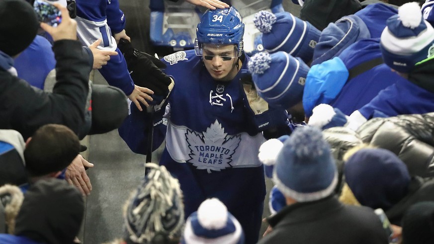 Jan 1, 2017; Toronto, Ontario, CAN; Toronto Maple Leafs center Auston Matthews (34) is congratulated by fans as he walks off the field after scoring the game-winning goal in overtime against the Detro ...