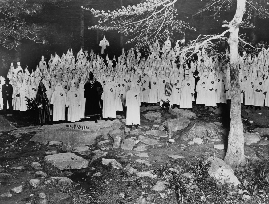 A Ku Klux Klan meeting in a forest in Stone Mountain, Georgia, US, 17th September 1921. (Photo by Hirz/Archive Photos/Getty Images)