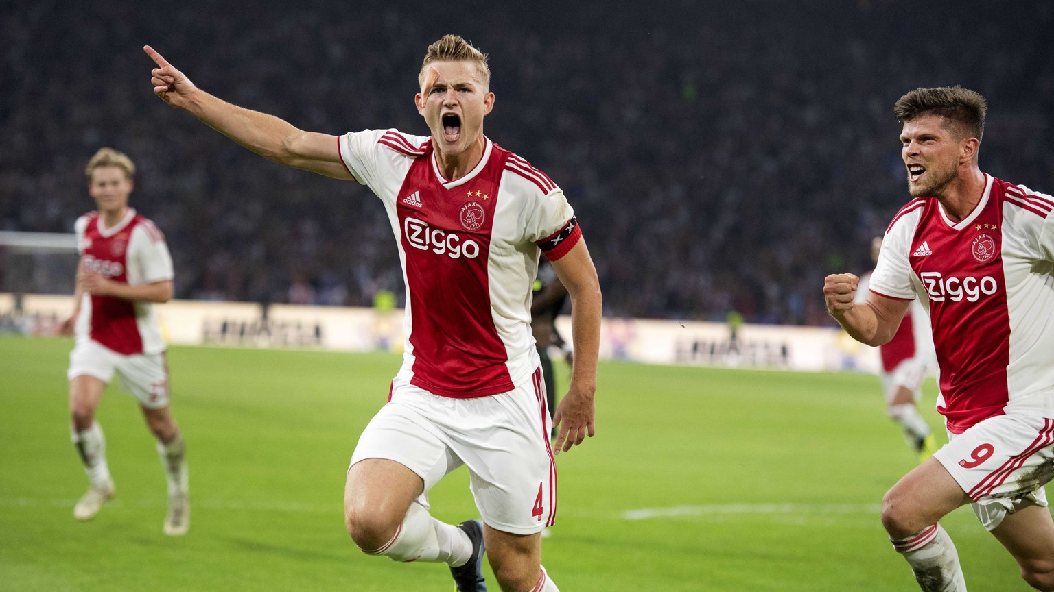 epa06949939 Matthijs de Ligt (C) of Ajax celebrates scoring during the UEFA Champions League third qualifying round, second leg soccer match between Ajax Amsterdam and Standard Liege in Amsterdam, The ...