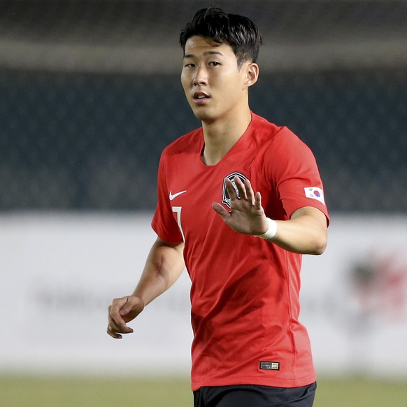South Korea&#039;s Son Heung Min waves as he runs into the pitch as a replacement during their men&#039;s soccer match between South Korea and Malaysia at the 18th Asian Games at Si Jalak Harupat Stad ...