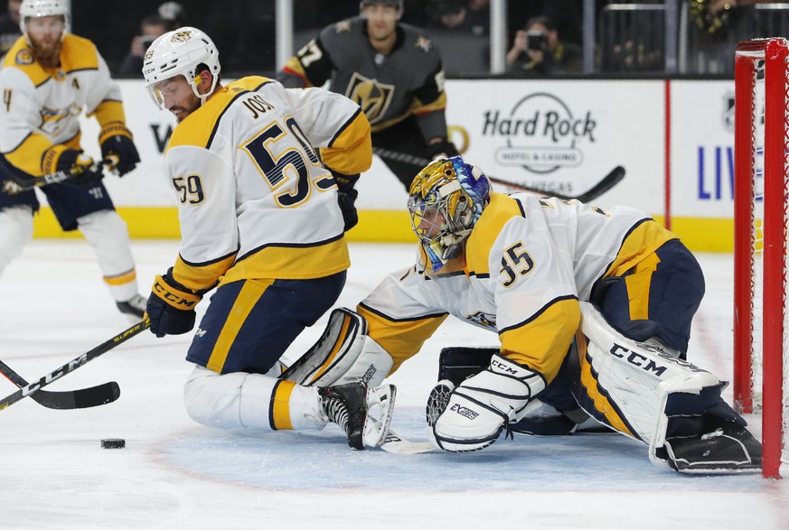 Nashville Predators goaltender Pekka Rinne (35) and defenseman Roman Josi (59) keep the puck away from the net during the second period of the team&#039;s NHL hockey game against the Vegas Golden Knig ...