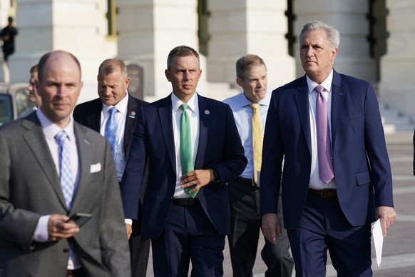 House Minority Leader Kevin McCarthy, R-Calif., right, and other Republican House members, walk out to hold a news conference as the select committee on the Jan. 6 attack appointed by House Speaker Na ...