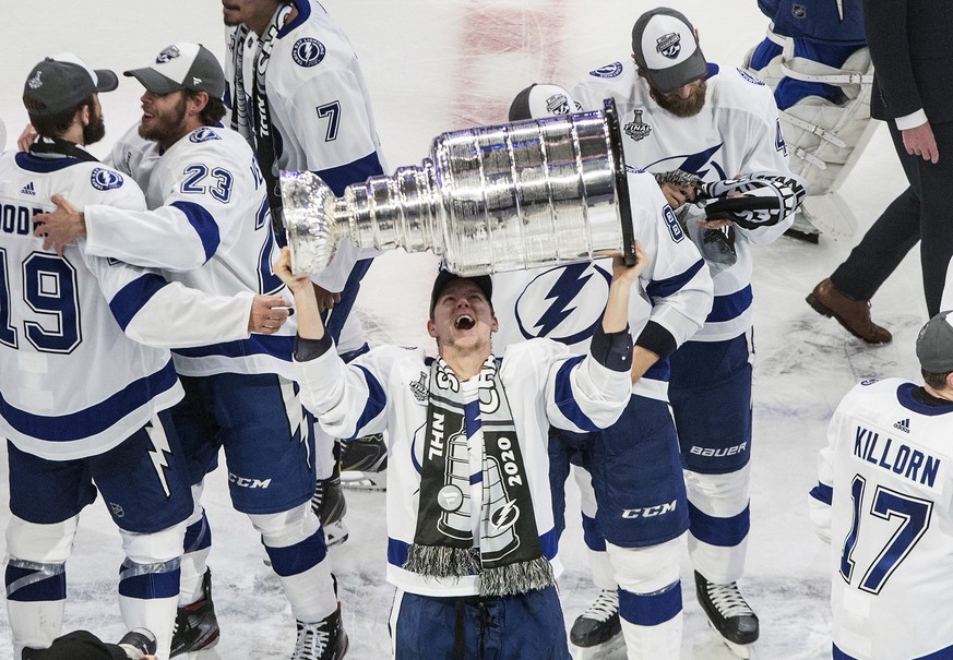 Tampa Bay Lightning&#039;s Ondrej Palat (18) hoists the Stanley Cup after defeating the Dallas Stars in the NHL Stanley Cup hockey finals, in Edmonton, Alberta, on Monday, Sept. 28, 2020. (Jason Frans ...