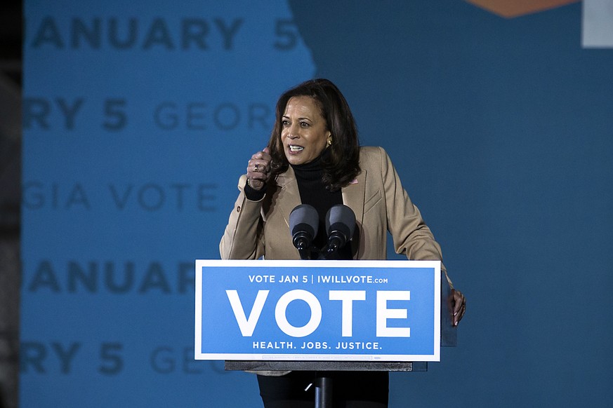 Vice President-elect Kamala Harris speaks at a drive-in rally in Savannah, Ga., during a campaign stop for Democratic U.S. Senate candidates, the Rev. Raphael Warnock and Jon Ossoff, Sunday, Jan. 3, 2 ...