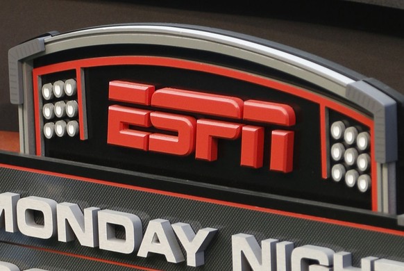 FILE - This Sept. 16, 2013, file photo shows the ESPN logo prior to an NFL football game between the Cincinnati Bengals and the Pittsburgh Steelers, in Cincinnati. ESPN is reminding employees of the n ...