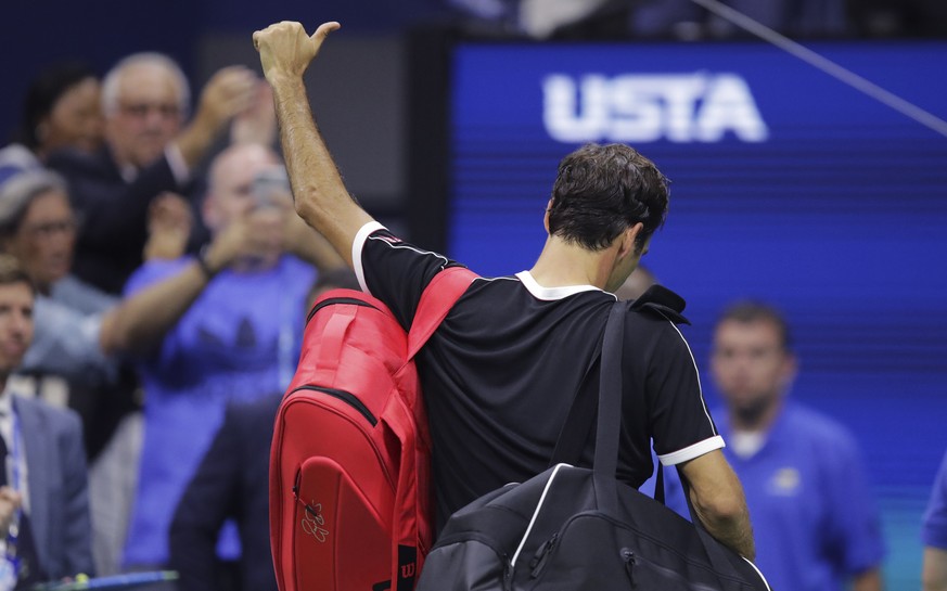 Roger Federer, of Switzerland, flashes a thumbs-up to the crowd after a loss to Grigor Dimitrov, of Bulgaria, during the quarterfinals of the U.S. Open tennis tournament Tuesday, Sept. 3, 2019, in New ...