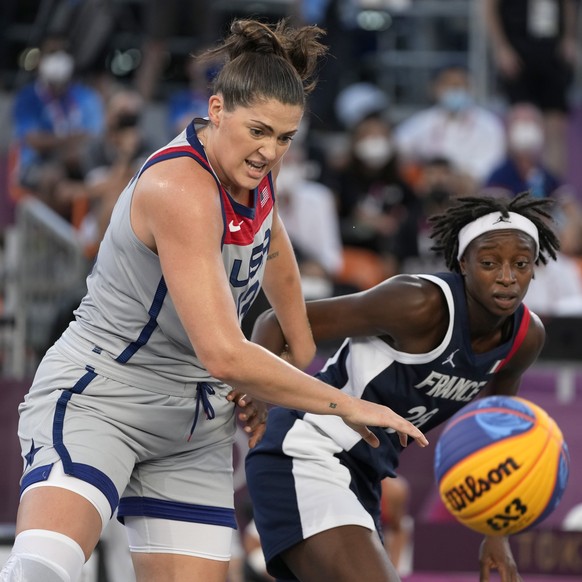 United States&#039; Stefanie Dolson, left, and France&#039;s Mamignan Toure chase a loose ball during a women&#039;s 3-on-3 semifinal basketball game at the 2020 Summer Olympics, Wednesday, July 28, 2 ...