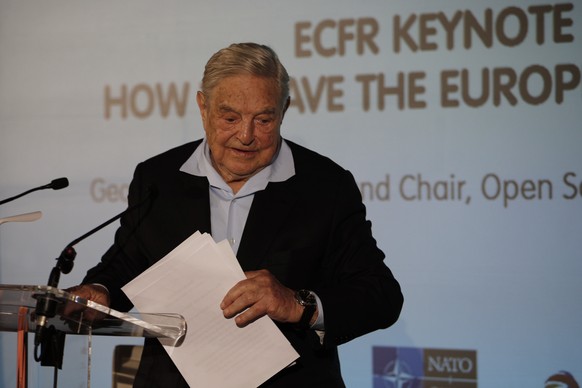 George Soros, Founder and Chairman of the Open Society Foundations leaves after his speech entitled &quot;How to save the European Union&quot; as he attends the European Council On Foreign Relations A ...