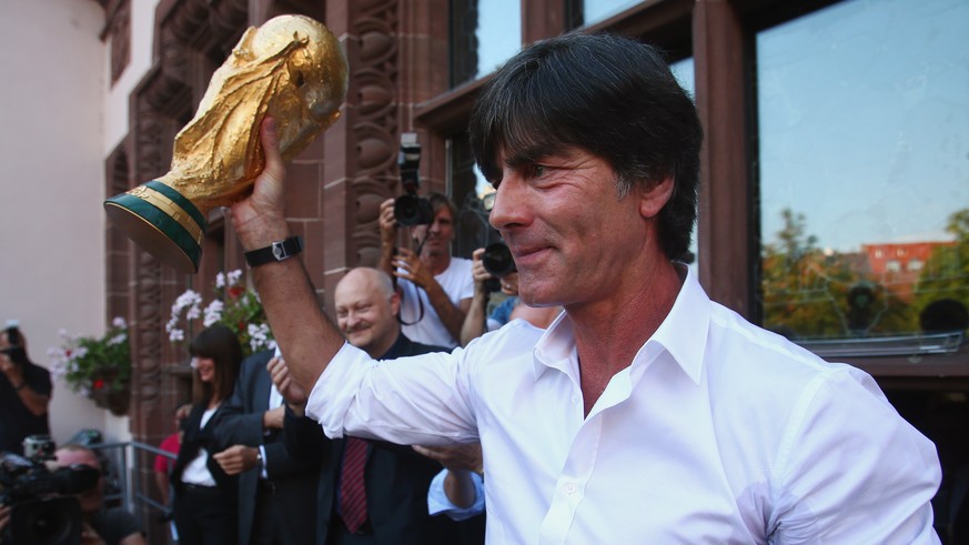 FREIBURG IM BREISGAU, GERMANY - SEPTEMBER 09: Germany coach Joachim Loew presents the FIFA World Cup trophy during a reception in his honour on September 9, 2014 in Freiburg im Breisgau, Germany. (Pho ...