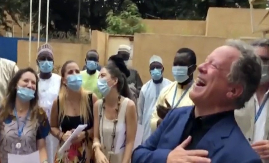 In this image taken from WFP video, David Beasley, Executive director of the World Food Program (WFP), center, celebrates with members of WFP staff in Niamey, Niger, Friday Oct. 9, 2020, after being a ...