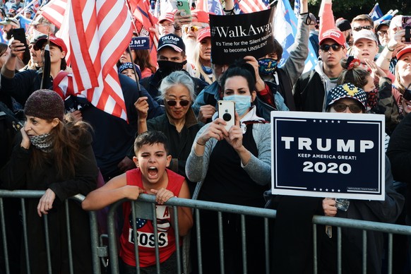 epaselect epa08821081 Trump supporters gather in front of the Supreme Court, in Washington, DC, USA, 14 November 2020. US President Donald J. Trump has refused to concede the 2020 Presidential electio ...