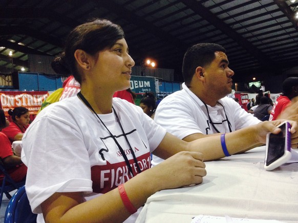 Fast food workers from across the U.S. attend a convention in Villa Park, Ill. on Saturday, July 26, 2014. Comparing their campaign to the civil rights movement, fast food workers from across the coun ...
