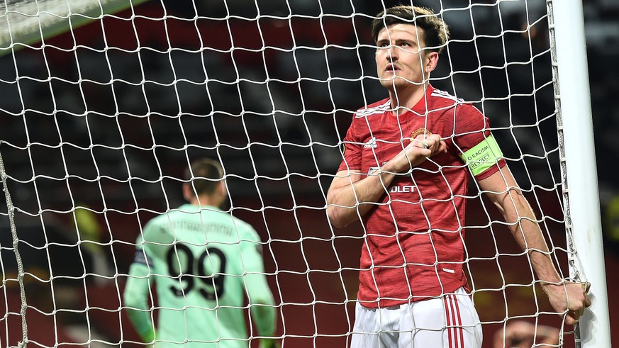 epa09068352 Harry Maguire of Manchester United reacts during the UEFA Europa League round of 16, first leg soccer match between Manchester United and AC Milan in Manchester, Britain, 11 March 2021. EP ...