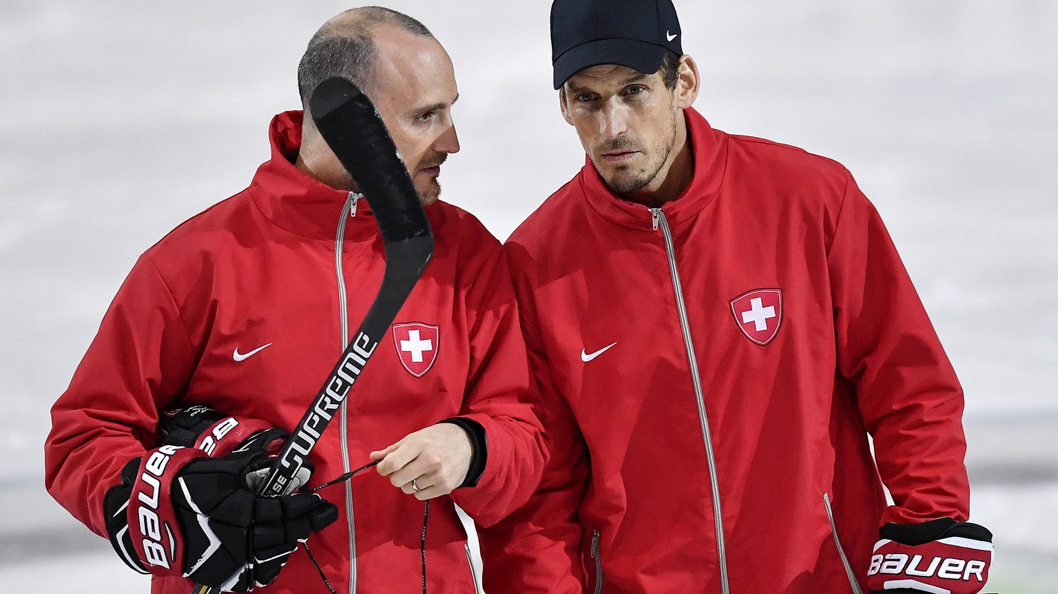 Switzerland’s head coach Patrick Fischer, right, and his assistant coach Christian Wohlwend speak during a training session during the Ice Hockey World Championship in Paris, France on Wednesday, May  ...