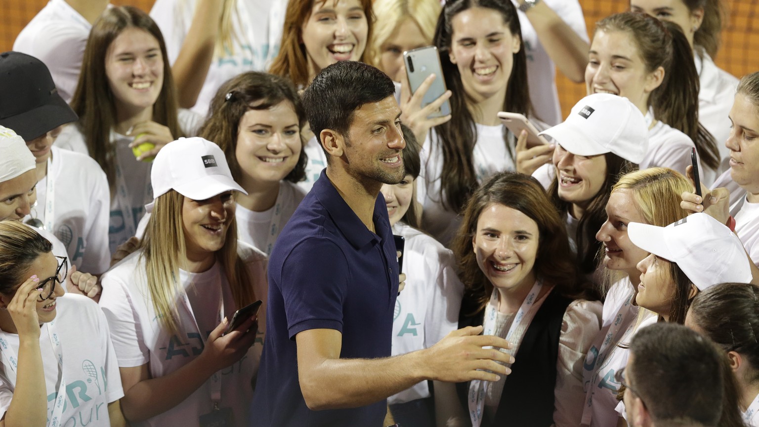 epa08485671 Novak Djokovic (C) of Serbia reacts with staff after the final match at the Adria Tour tennis tournament in Belgrade, Serbia, 14 June 2020. The Adria Tour will be held until 05 July in a n ...