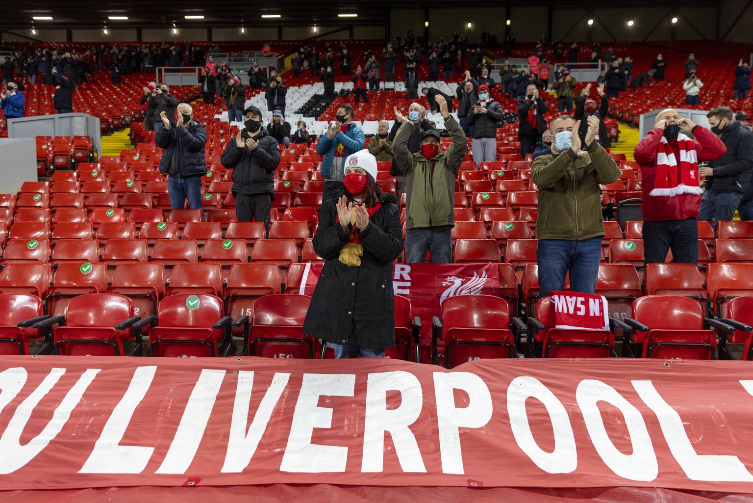 201207 -- LIVERPOOL, Dec. 7, 2020 -- Liverpool s supporters react before the English Premier League match between Liverpool FC and Wolverhampton Wanderers FC in Liverpool, Britain, on Dec. 6, 2020. FO ...