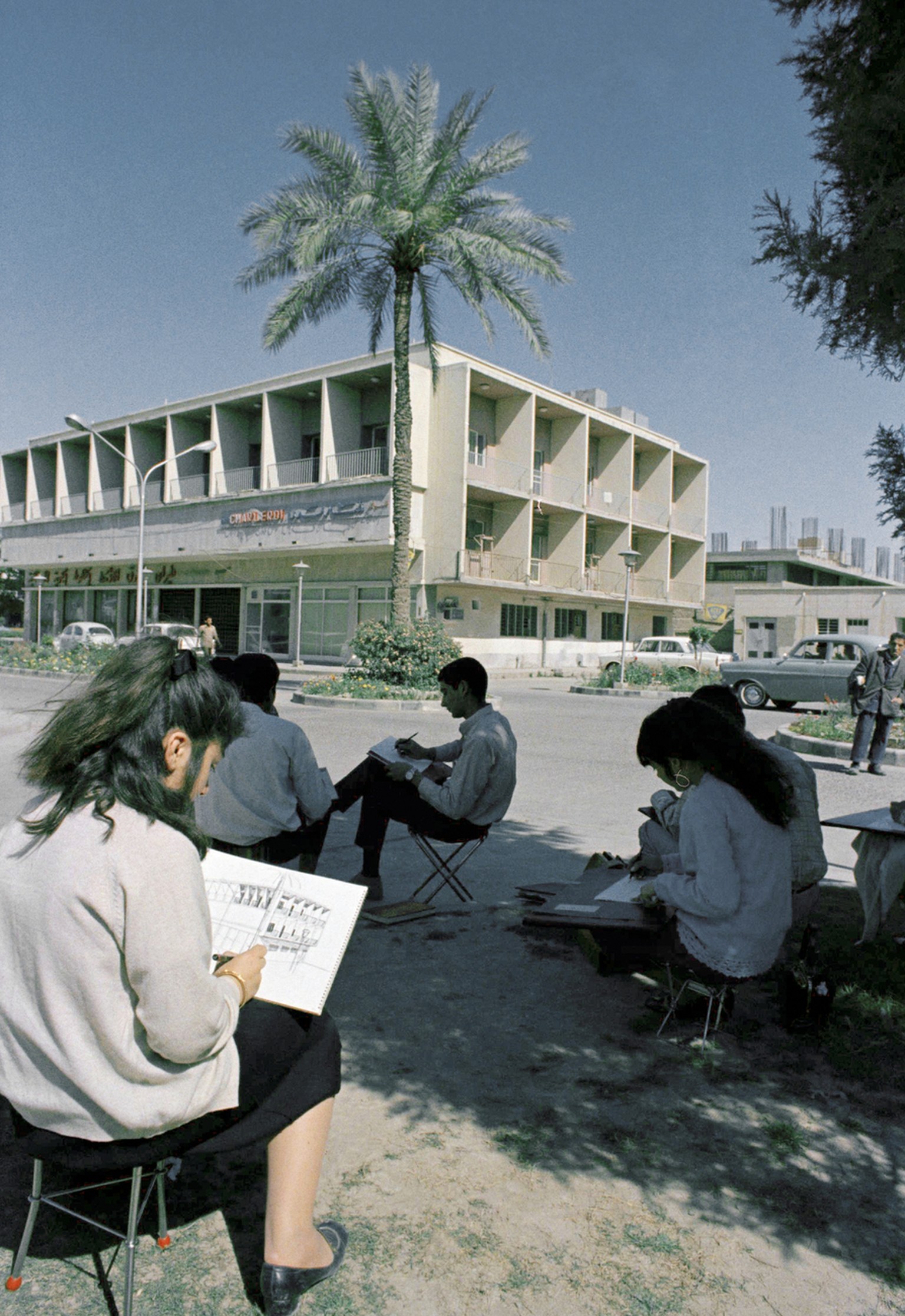 Student&#039;s of Baghdad&#039;s engineering school making drawings of a Baghdad, Iraq street on Nov. 11, 1969. (AP Photo)